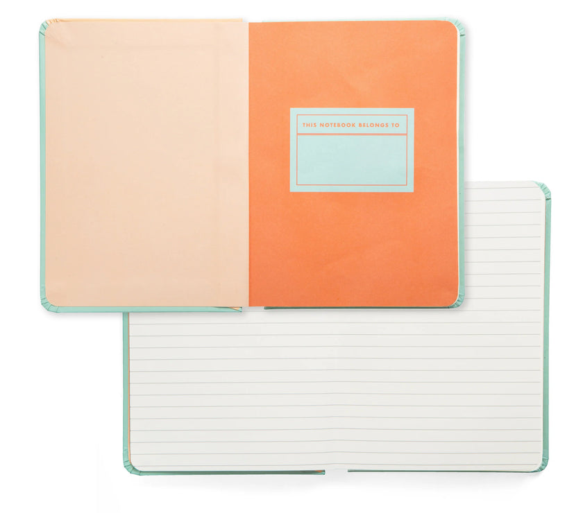 Two open notebooks; one shows the "this notebook belongs to" page and the other shows lined pages.