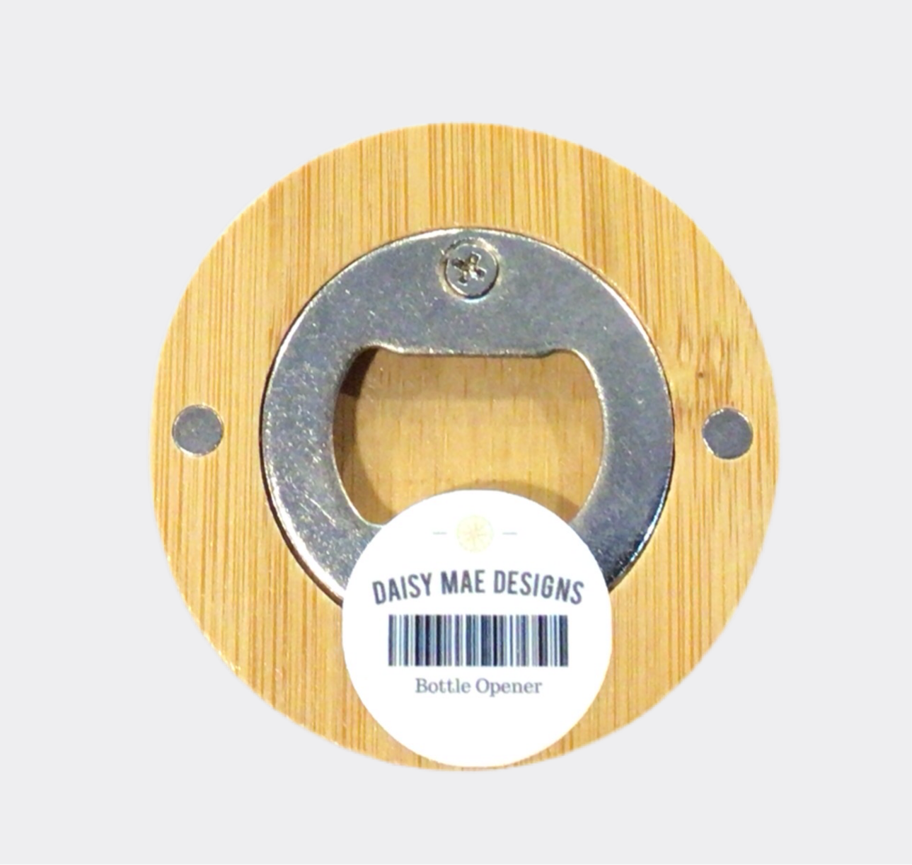 The back of a round bamboo bottle opener with a map of Independence, Missouri, in the center.