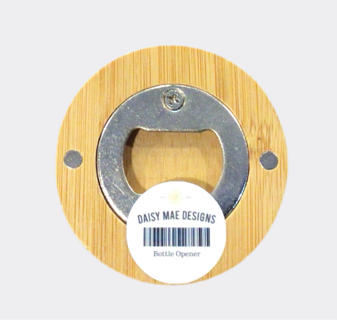 The back of a round bamboo bottle opener with a map of Independence, Missouri, in the center.