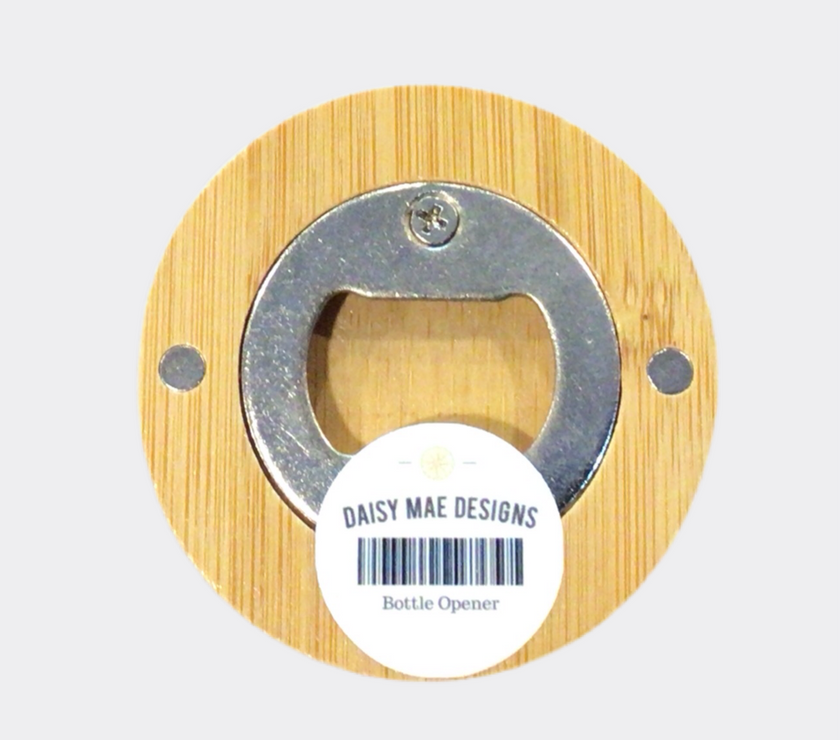 The back of a round bamboo bottle opener with a map of Independence, Missouri, in the center.