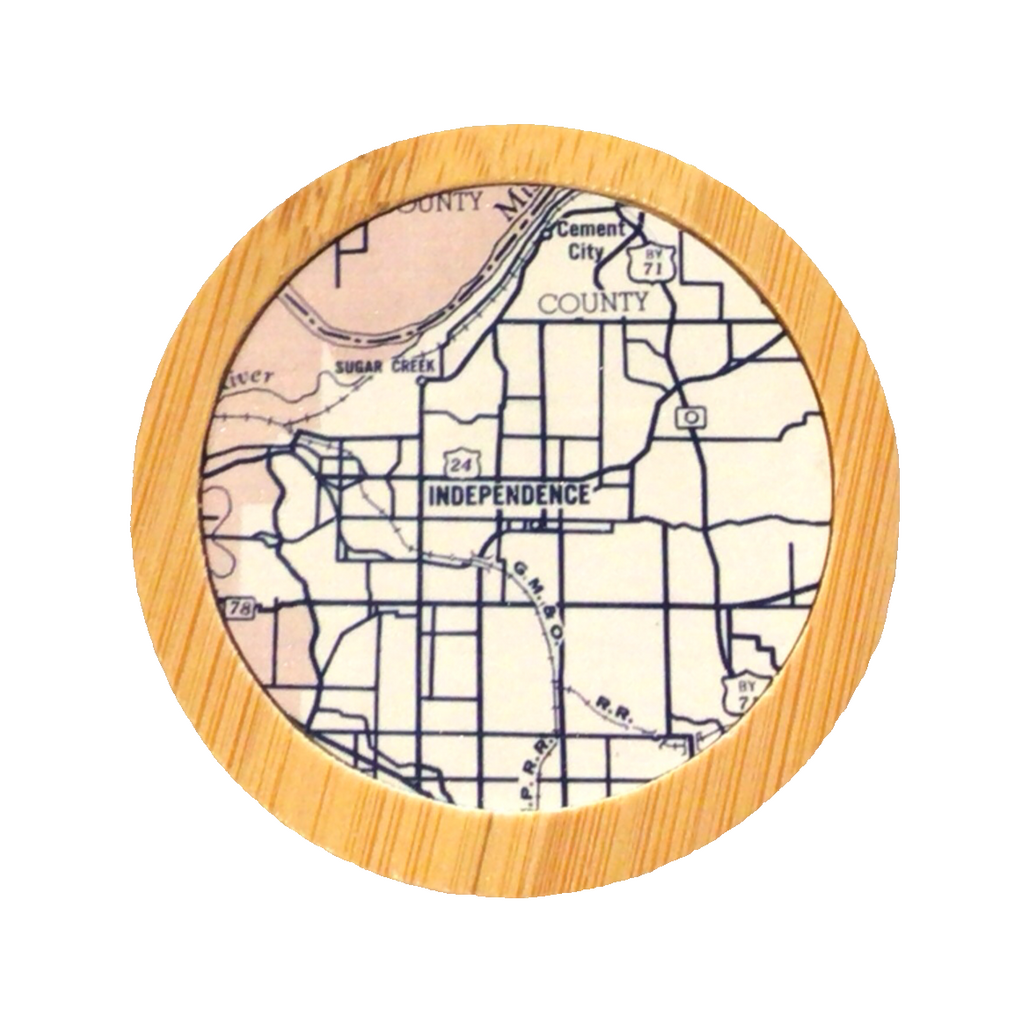 A round bamboo bottle opener with a map of Independence, Missouri, in the center.