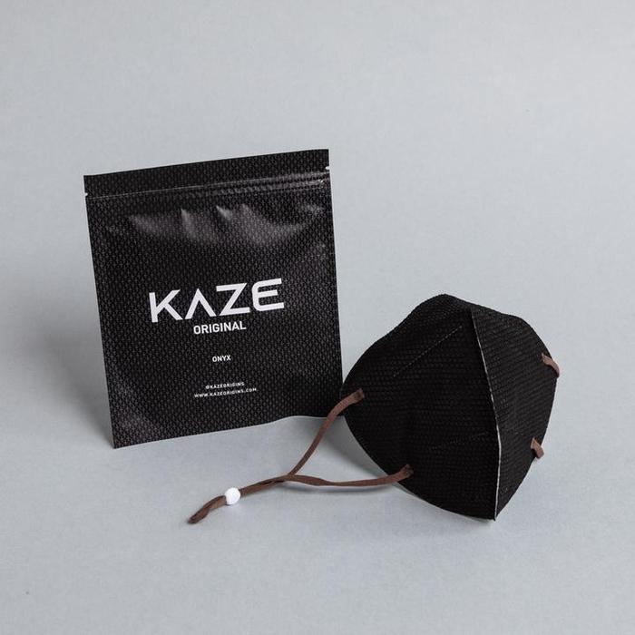Black KAZE mask and packaging on a gray background