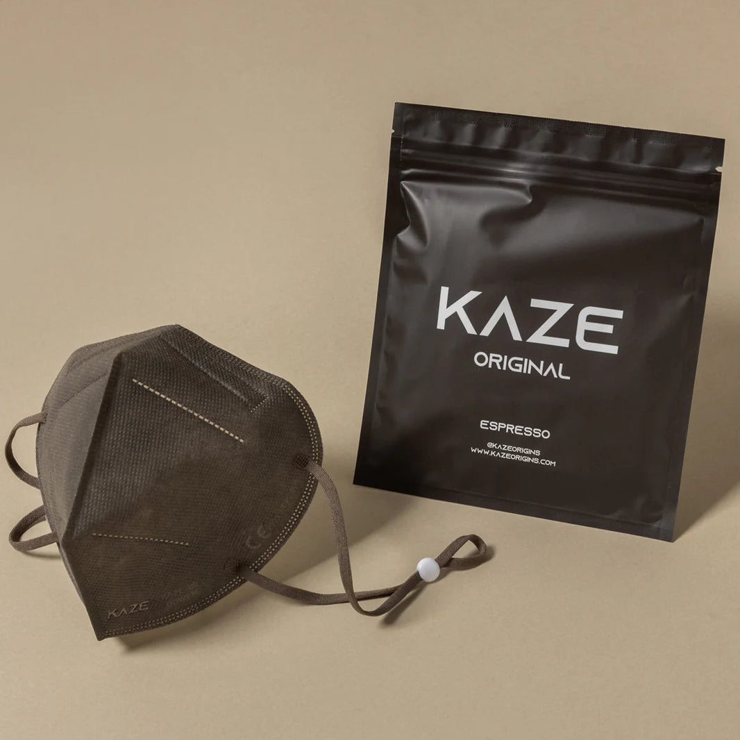 Black Kaze packaging and face mask on a beige background