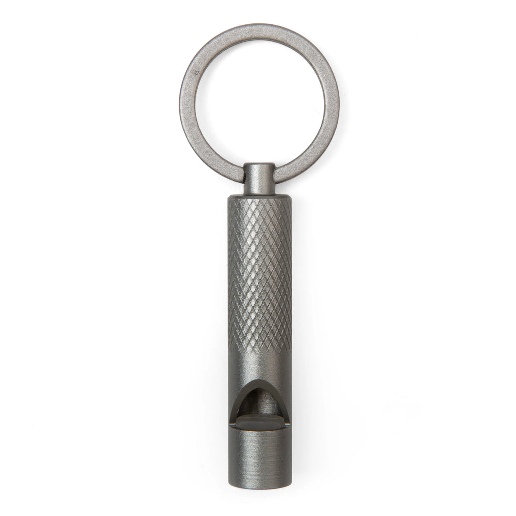 Metal keychain with textured design on a white background