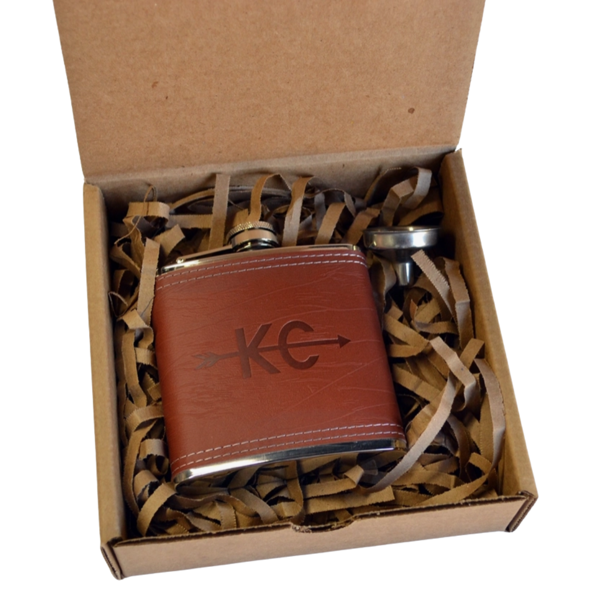Brown leather flask with metal cap in a cardboard box with tissue paper