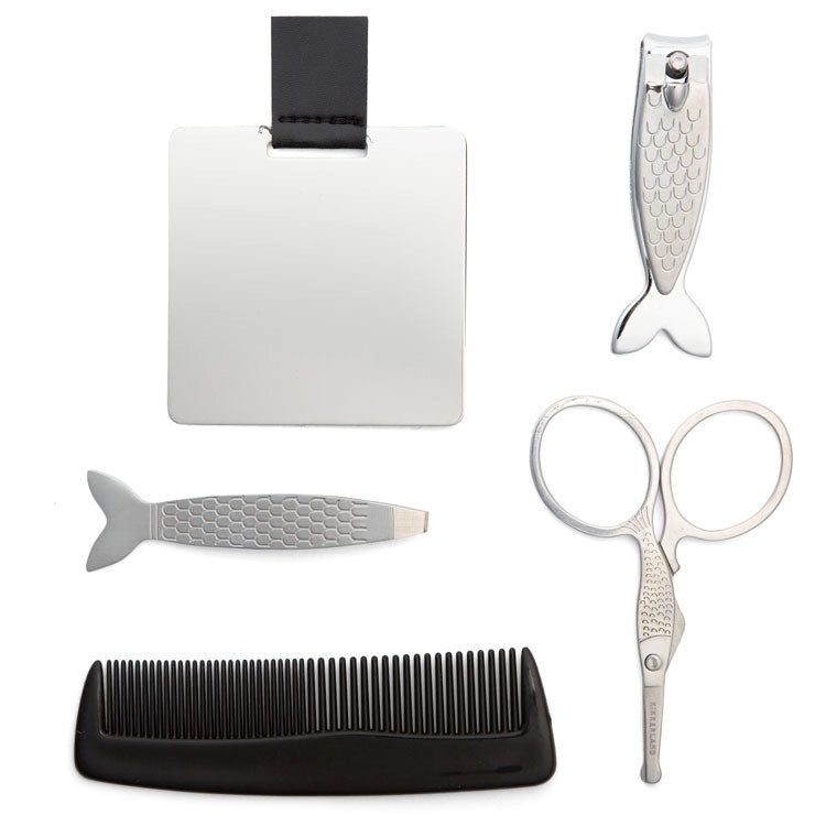 Set of grooming tools including a comb, scissors, nail clipper, and tweezers on a white background.