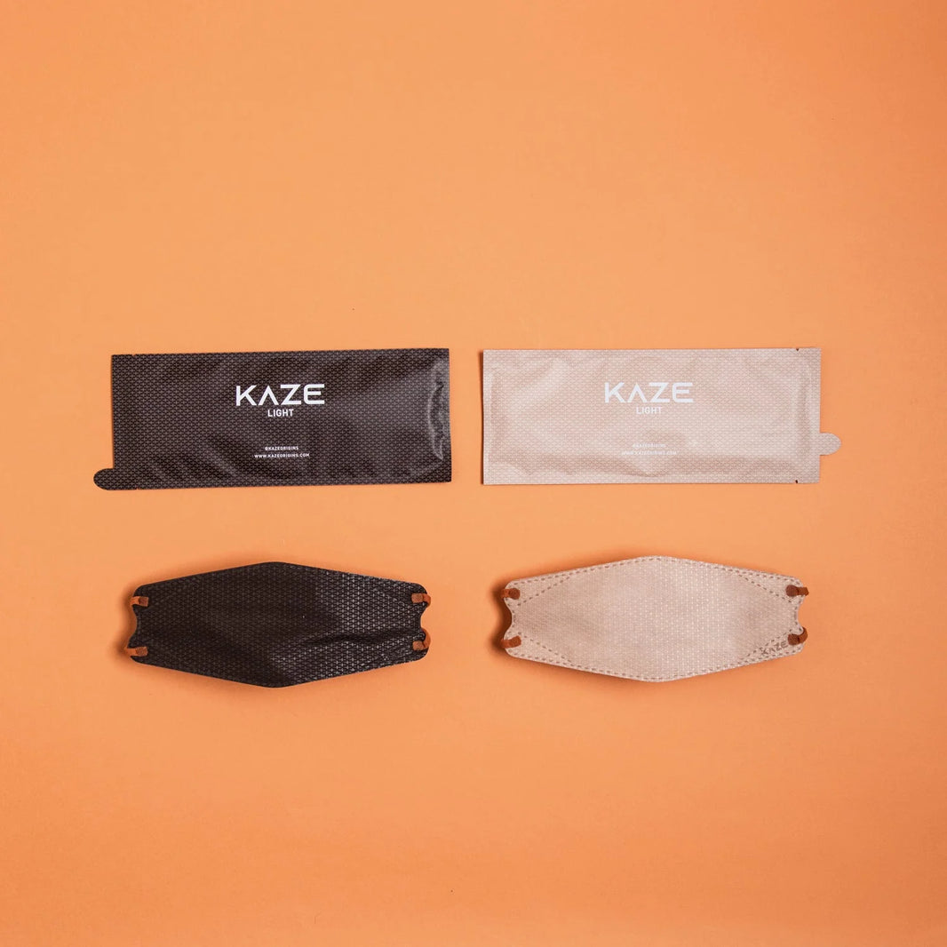 KAZE face masks and packaging on an orange background
