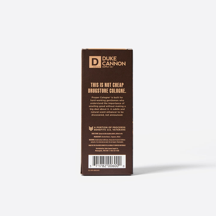 The back of a package of Duke Cannon Proper Cologne in scent Palomino with the phrase "this is not cheap drugstore cologne" in larger lettering.