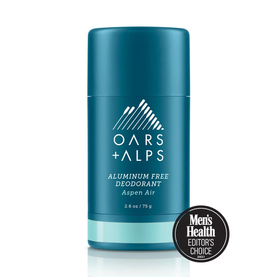 A stick deodorant with blue packaging labeled 'OARS + ALPS aluminum free deodorant'. There is a Men's Health Editors Choice badge displayed in front of the product.