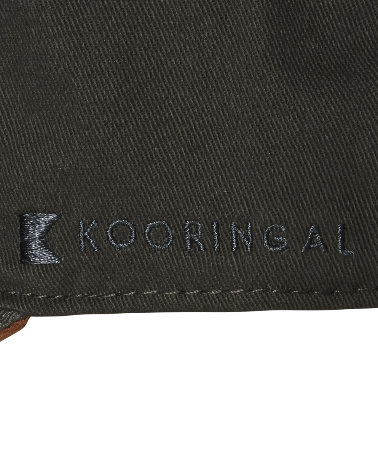 A close up of the Kooringal logo in black stitching on a gray baseball cap.