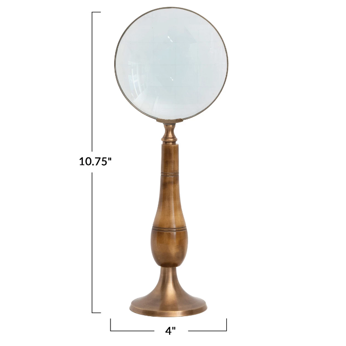 Vintage-style magnifying glass that acts as its own stand on a white background with dimensions indicated.