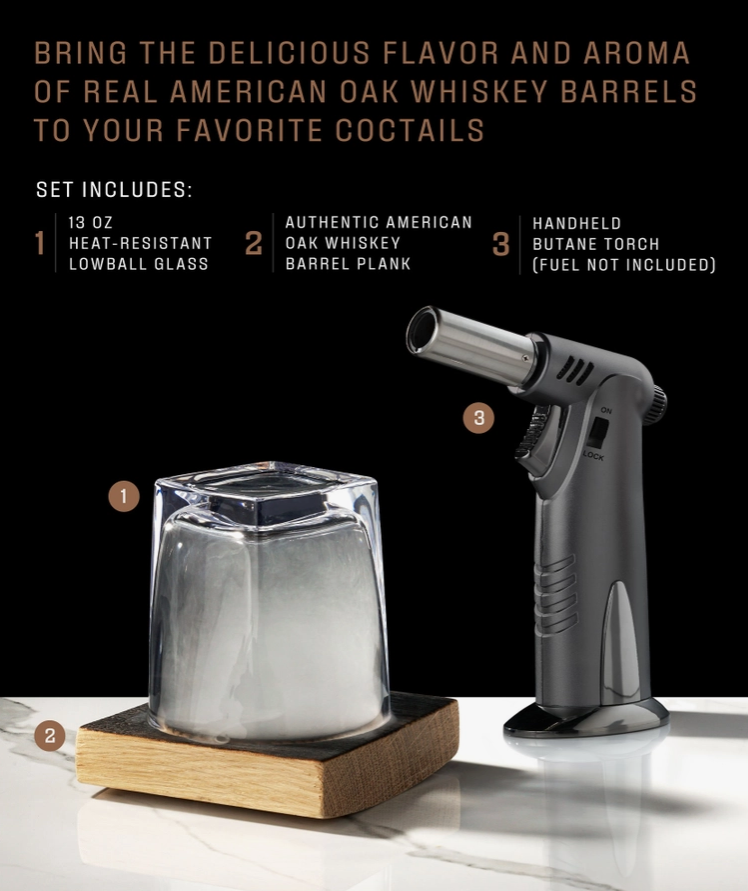 A set consisting of a clear lowball glass, a butane torch, and an American oak whiskey barrel plank, typically used for smoking cocktails, with details on what the set includes in text above.