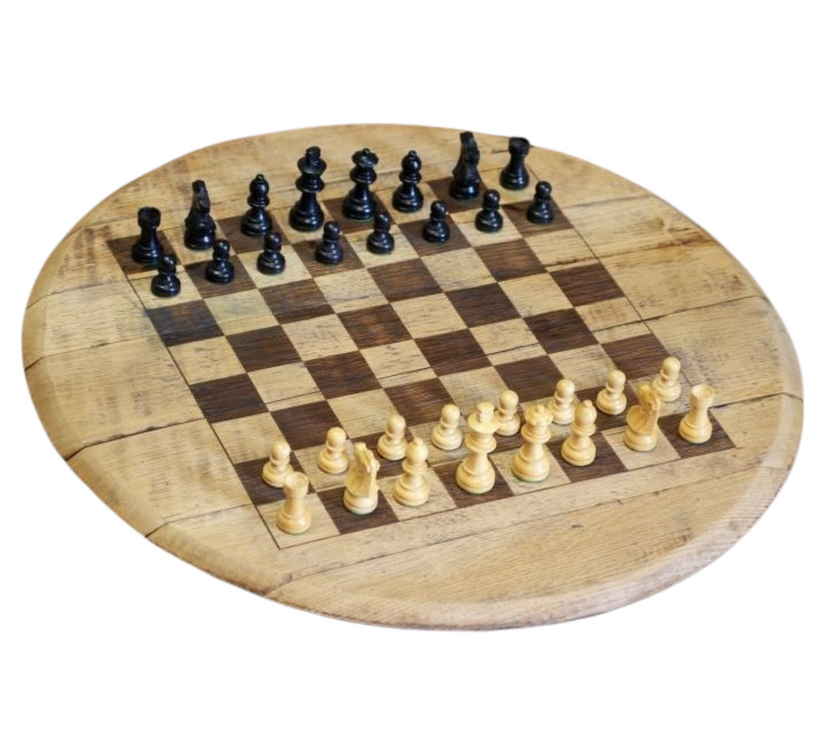 Wooden chessboard with black and white chess pieces on a white background