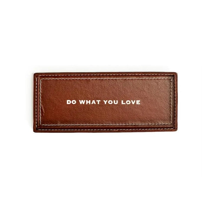 Brown leather tray with 'DO WHAT YOU LOVE' text on a white background