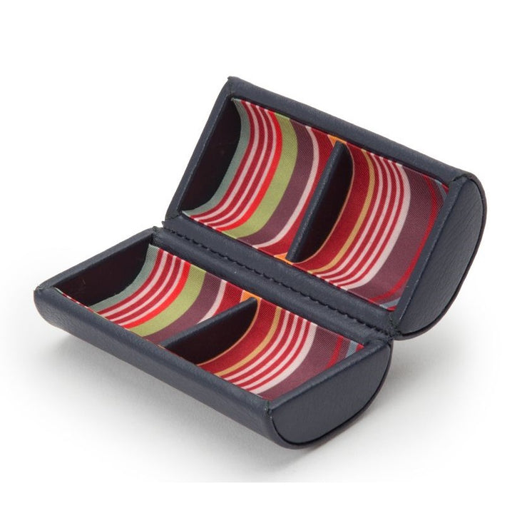 Cylindrical cufflink case with a colorful interior on a white background