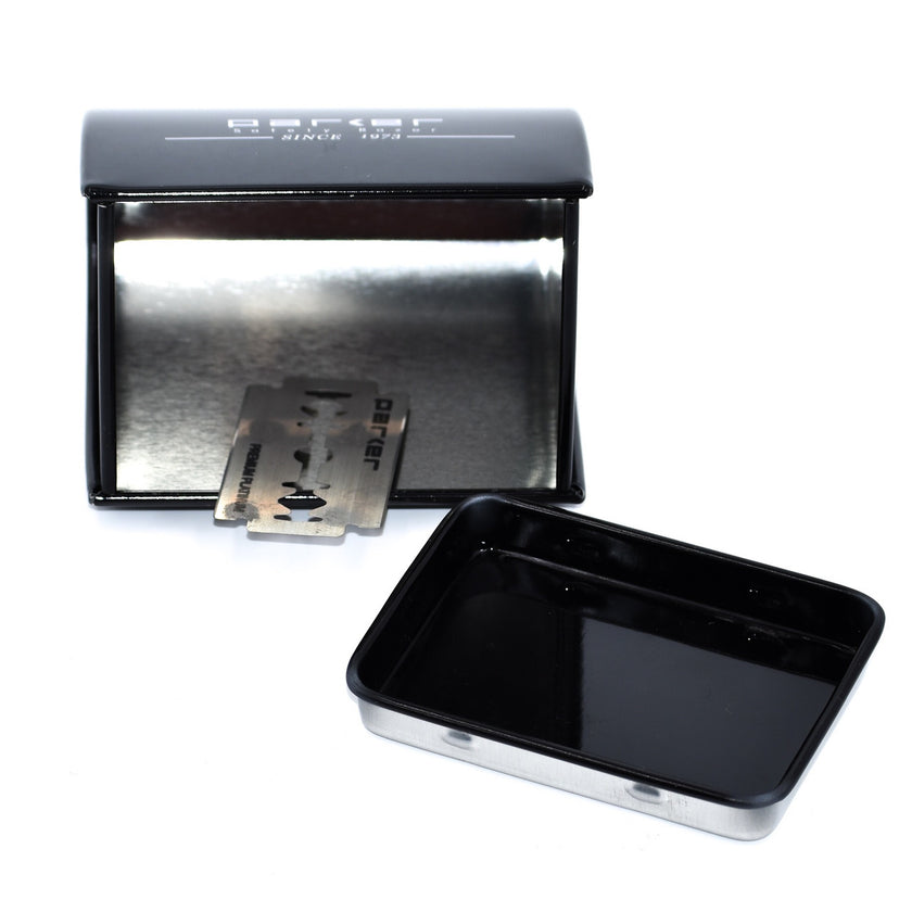An open black metal Parker blade disposal bank showing a razor blade inside.