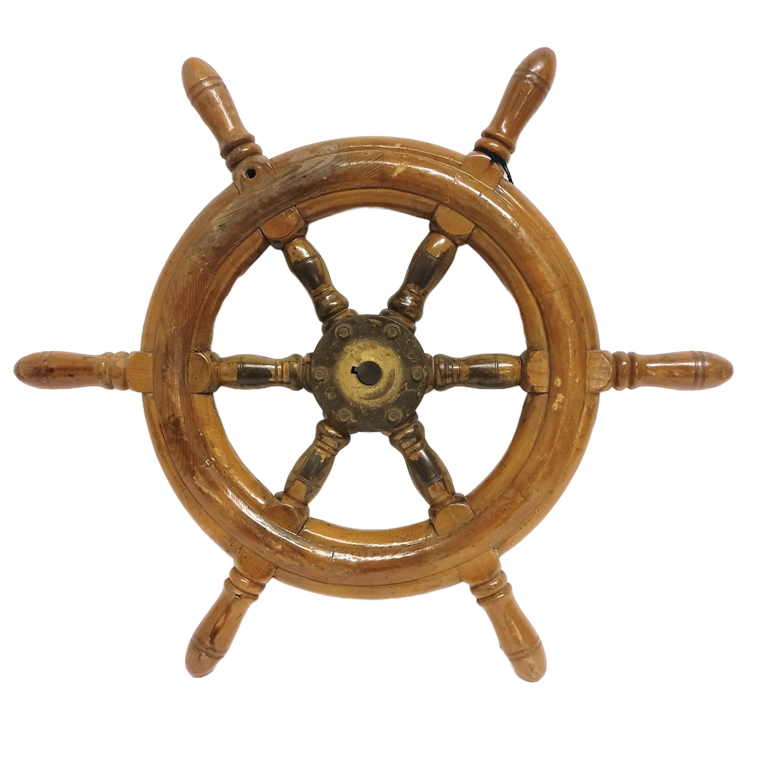 A vintage wooden ship steering wheel