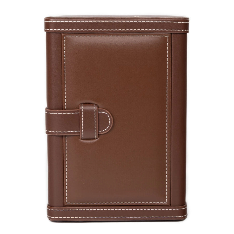 A leather wrapped humidor with white stitching on a white background.