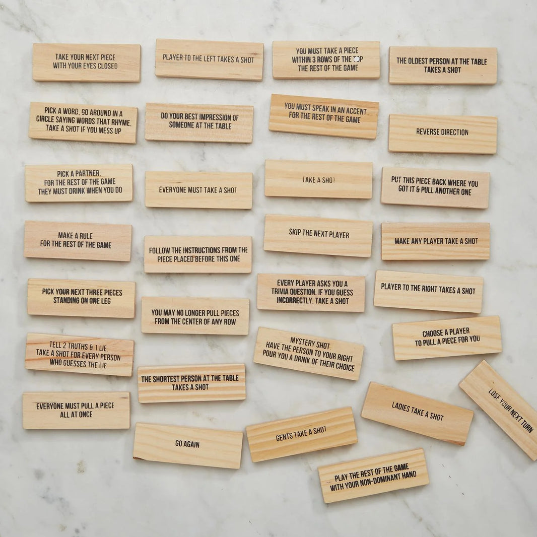 Several blocks for the Stumbling Blocks game with various actions written on them that a person can take while playing the game.