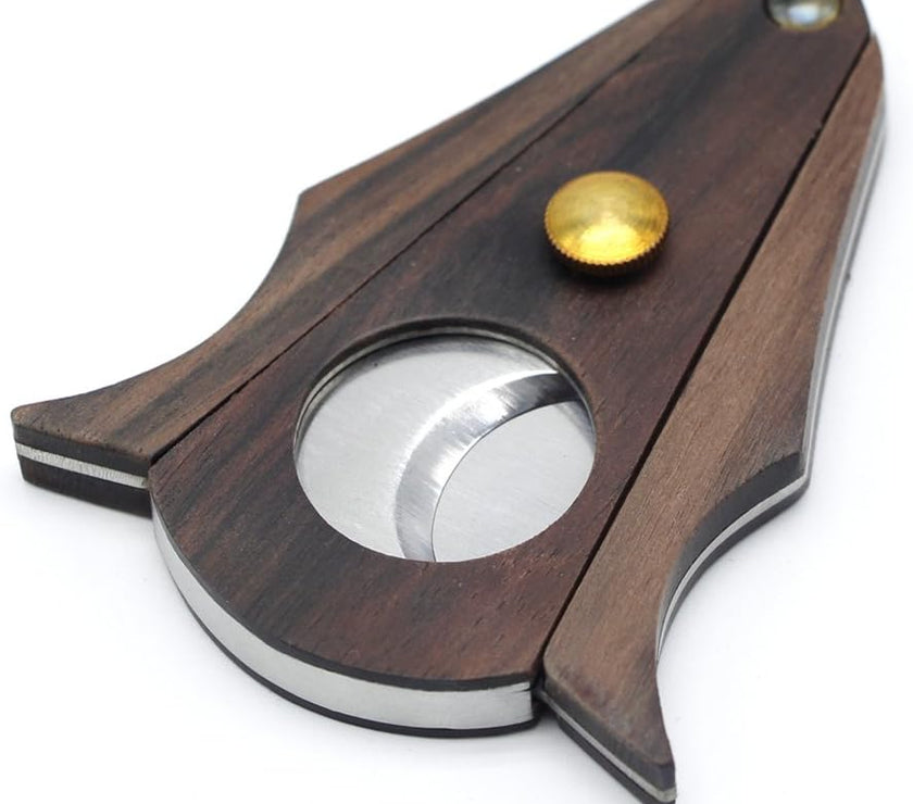Wooden and metal cigar cutter on a white background