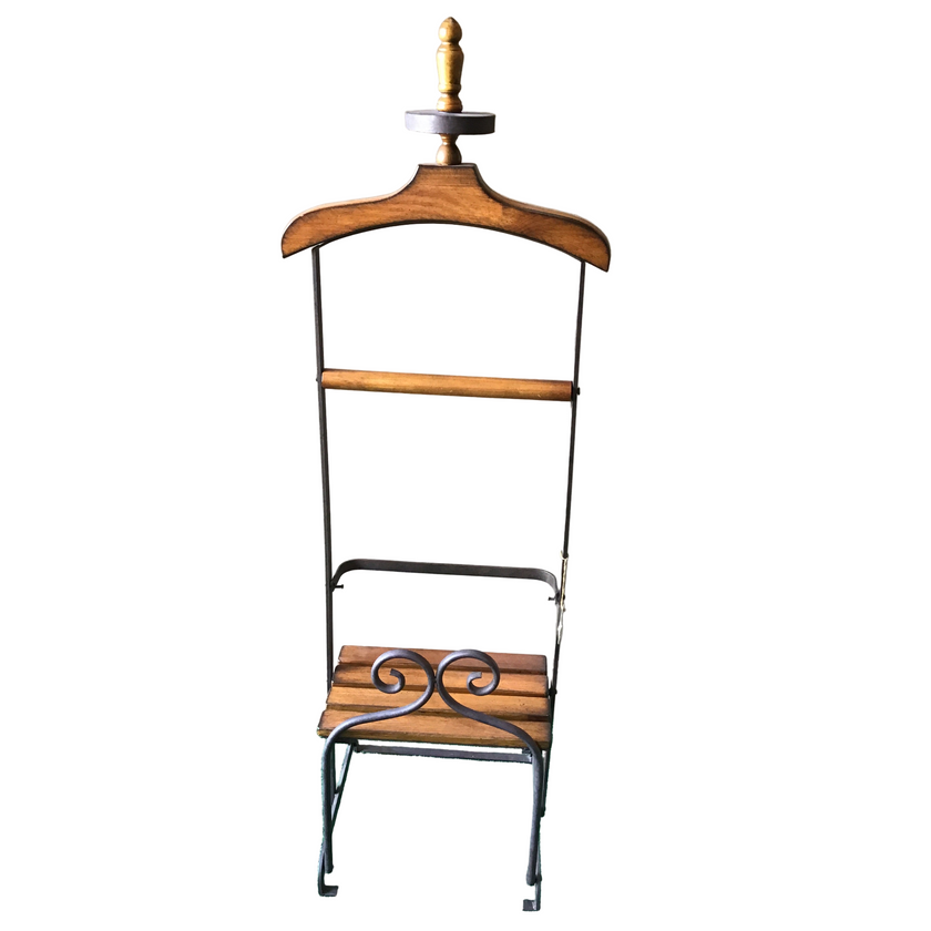 A clothing valet stand made of wood and metal.