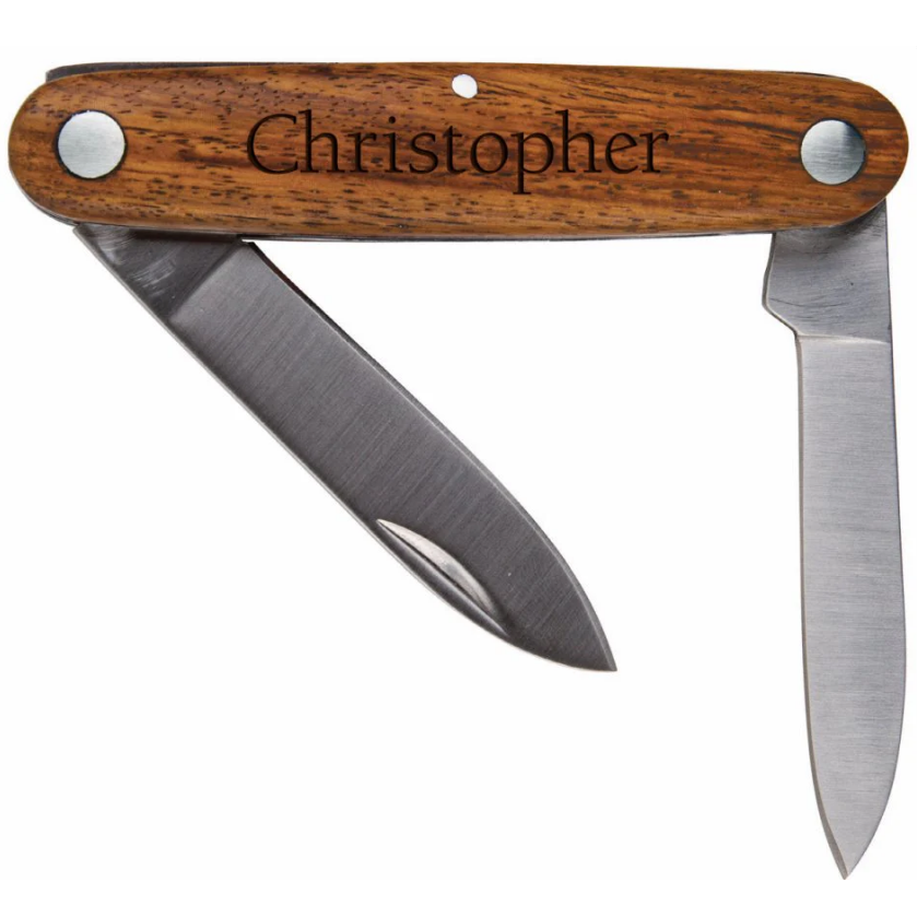 A pocket knife with two blades engraved with the name "Christopher"