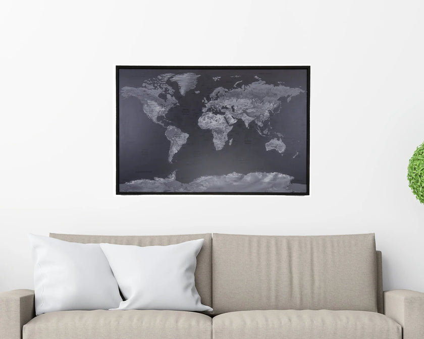 World map poster on a wall above a sofa