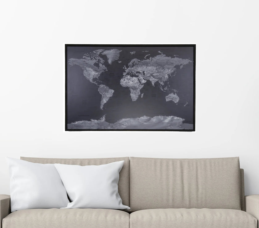World map poster on a wall above a sofa