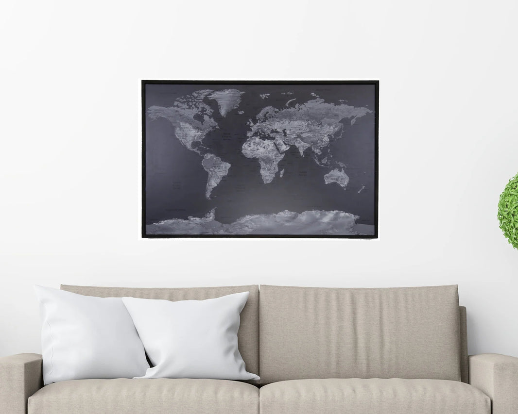 World map poster on a wall above a sofa