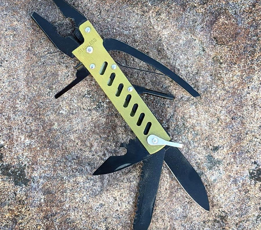 Multitool with knife blade on a textured surface