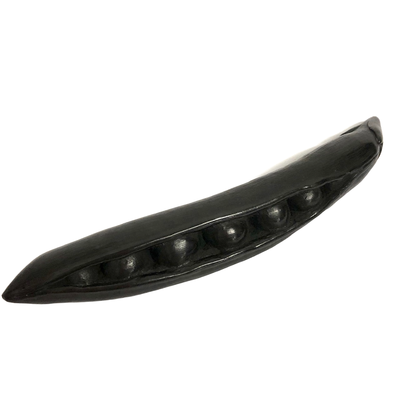 A hand-carved graphite object, crafted to look like a pea pod, displayed against a white background.