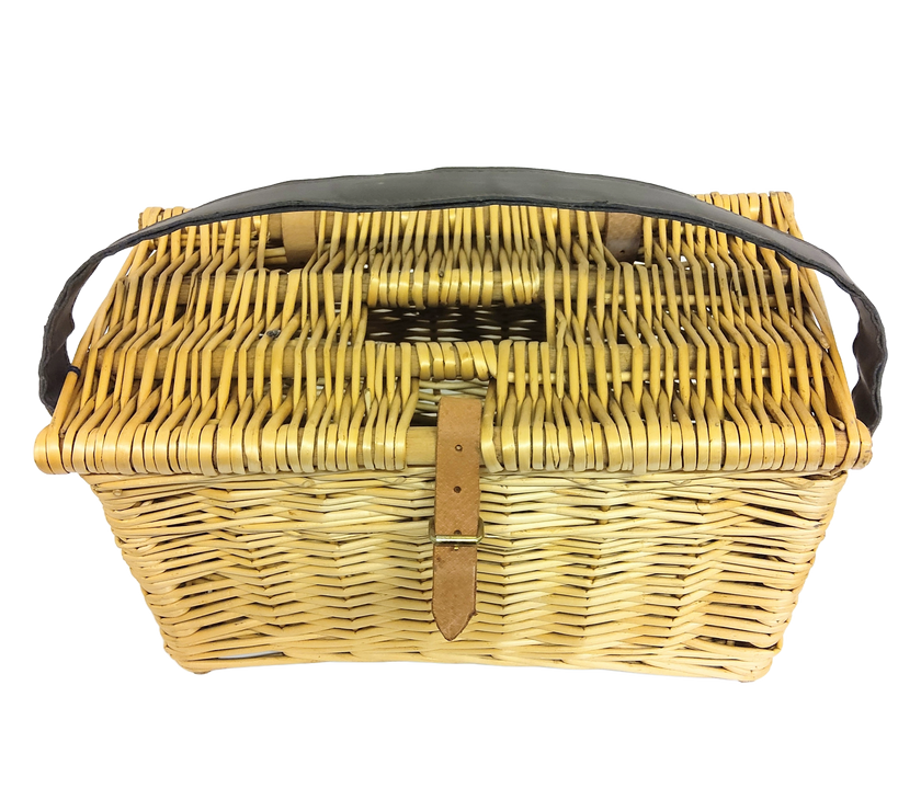 A hand woven fishing basket with leather strap.