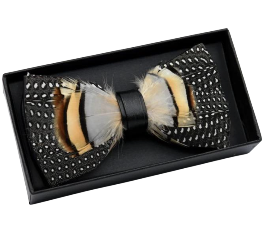 Feathered bow tie in a black box on a white background