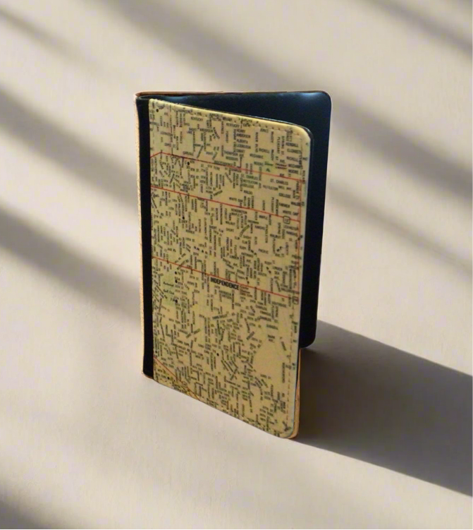 A personalized map passport wallet with three slots for cards, featuring a map of Independence, Missouri design on the cover.