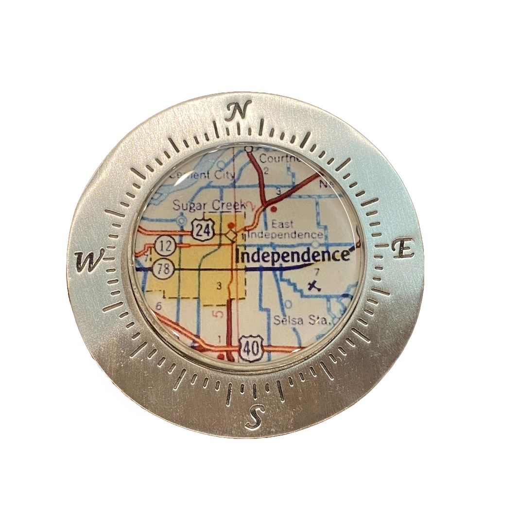 A pewter paperweight with a map of Independence, Missouri, showcased within a bezel.