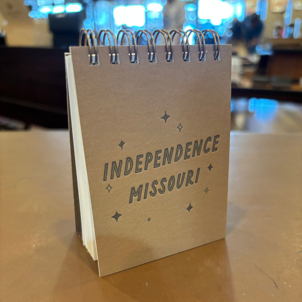 A brown spiral notebook stamped with "Independence, Missouri" and a few stars.