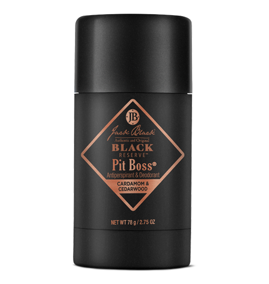 A roll-up stick of Jack Black Black Reserve Pit Boss Antiperspirant & Deodorant with cardamom and cedarwood notes, packaged in a black tube with a copper label.