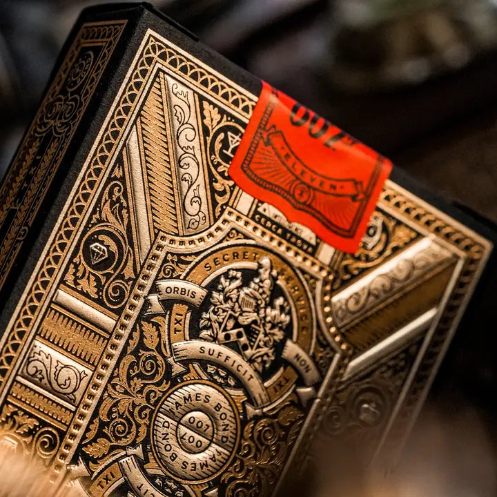 Decorative James Bond 007 playing card box with intricate designs and a red label.