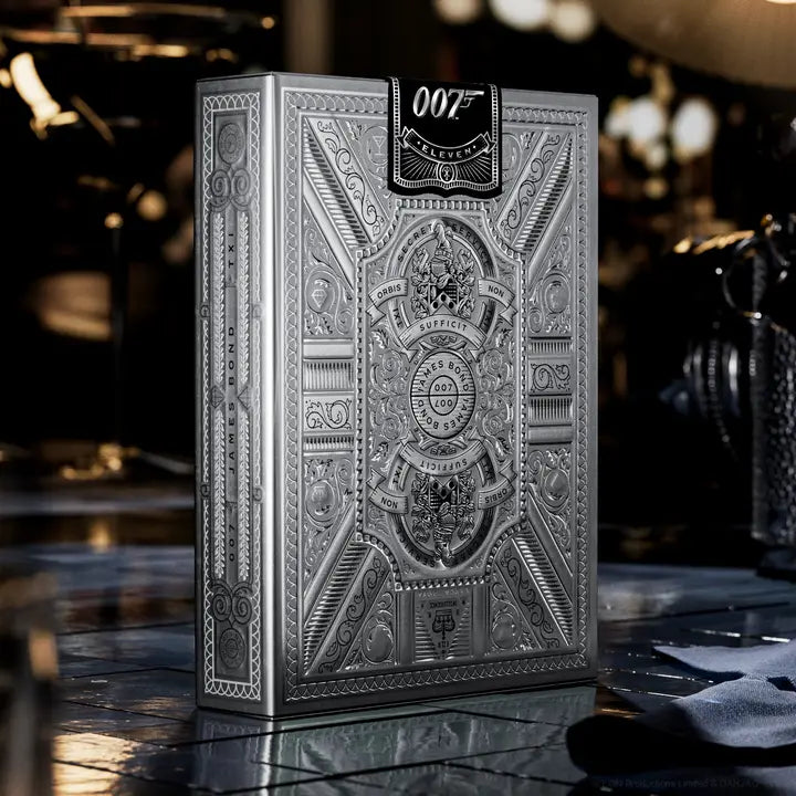 Decorative box with intricate patterns and '007' branding on a reflective surface.