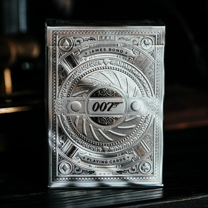Silver playing card deck with 007 branding on a dark background