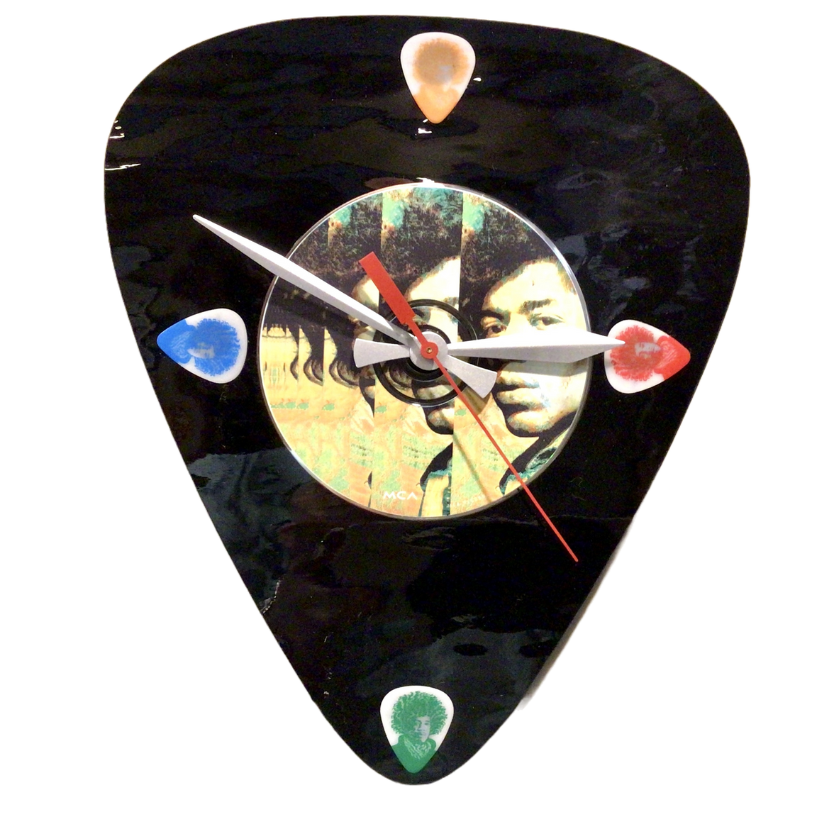 A decorative wall clock featuring a colorful image of a guitar and a portrait of Jimi Hendrix, with a black background and colorful accents.