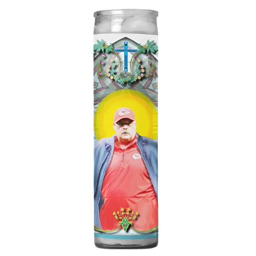 A prayer candle with a label featuring an image of Coach Andy Reid in a Kansas City Chiefs uniform, with a decorative border and a cross at the top.