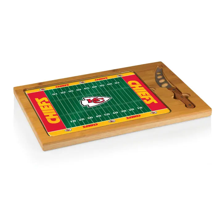 Cutting board with football field design and knife on a white background