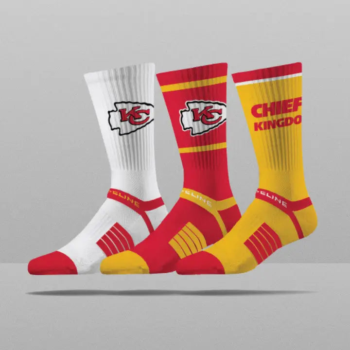 Three pairs of socks with different Kansas City Chiefs designs on a gray background