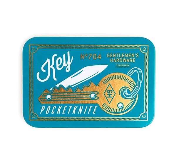 A blue-colored pocket knife tin with a key-shaped design, branded with 'Gentlemen's Hardware' and a serial number 'N704'.
