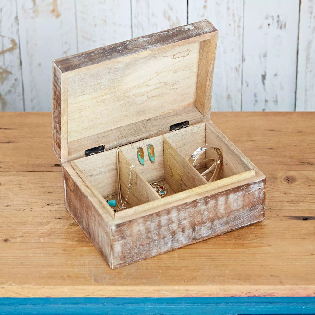 Antique effect partitioned wooden box with a hinged lid, opened to show the interior compartment, placed on a wooden surface.