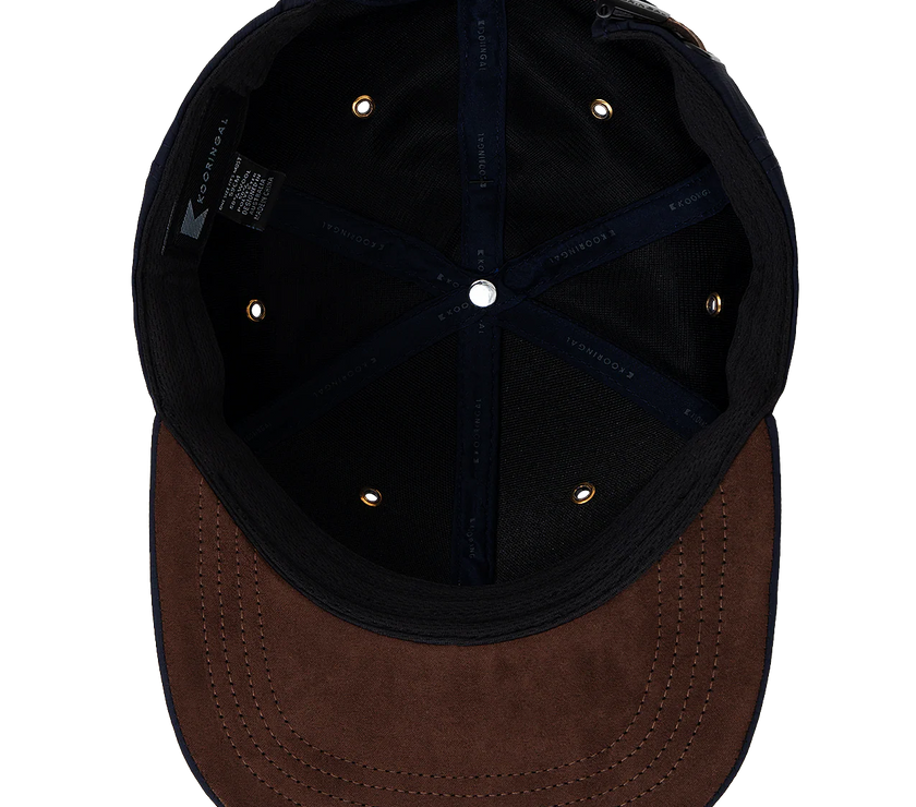 The interior of a men's ballcap by Kooringal in the color rust.