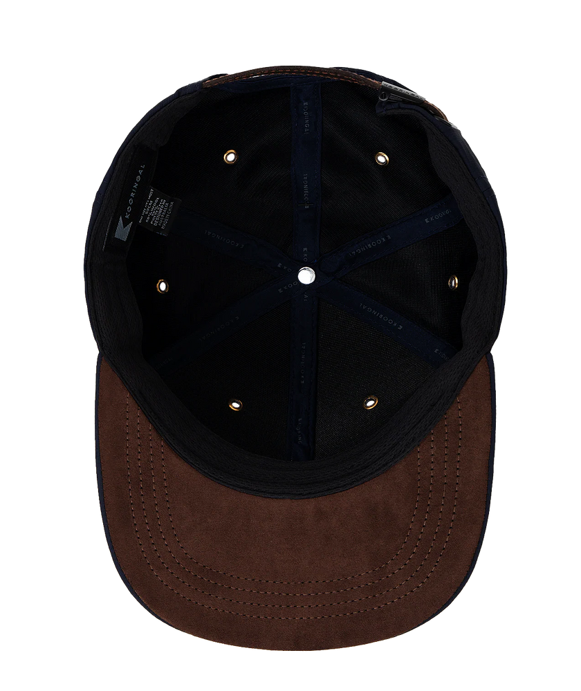 The interior of a men's ballcap by Kooringal in the color rust.