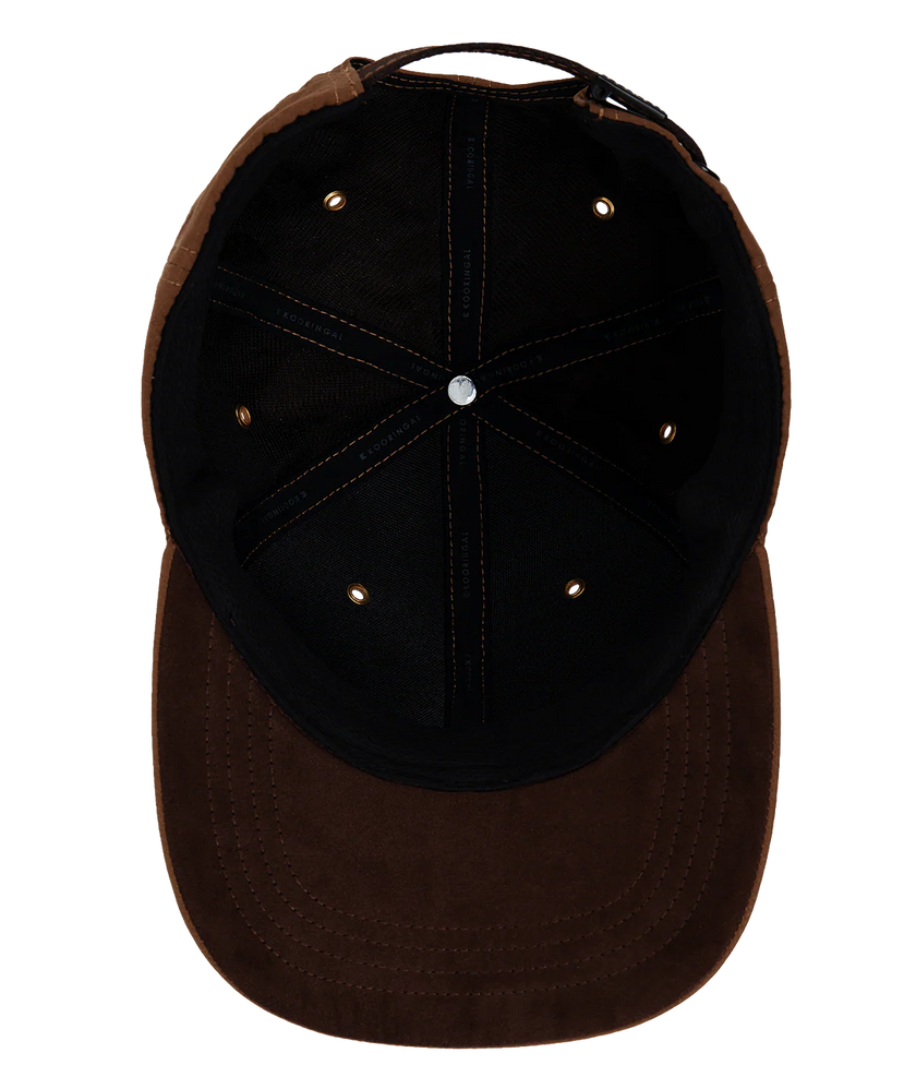 The interior of a Kooringal men's ball cap in the color rust.