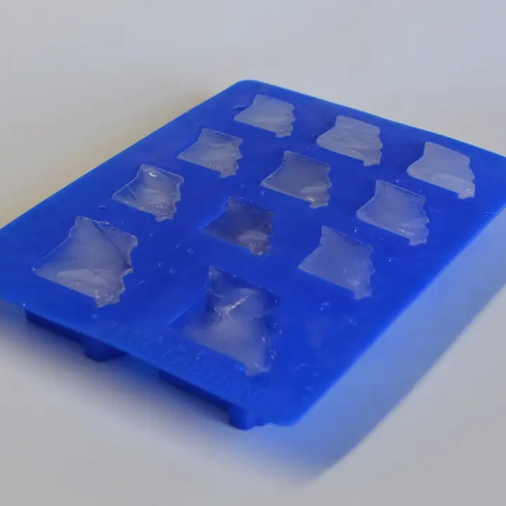An ice cube tray with ice in the shape of the state of MIssouri.
